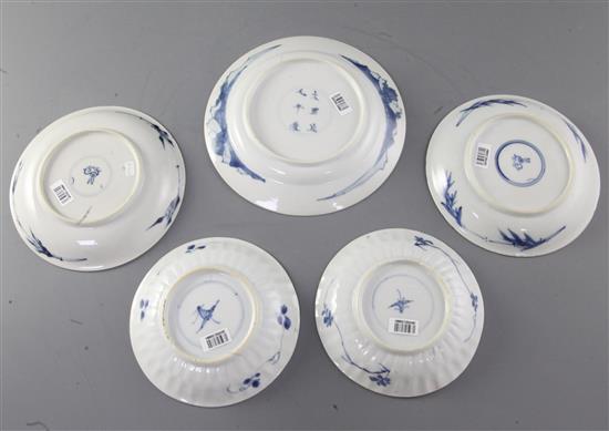 Four Chinese blue and white saucer dishes, and a similar plate, Kangxi period, (5)